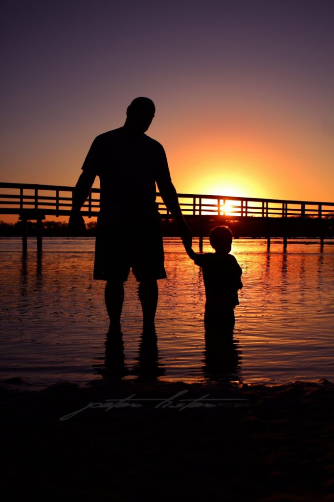 Aboriginal Father n Son Sunrise Scene Urunga NSW Australia